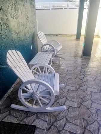 a view of a balcony with chair