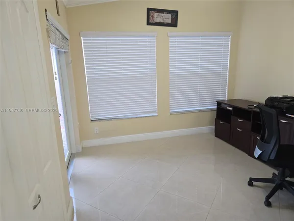 a workspace with furniture and a window