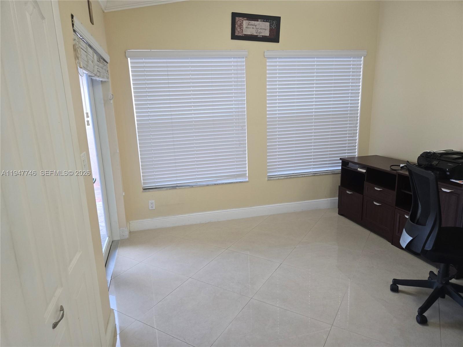 2749 West 73rd Place Hialeah, FL 33016 - Photo 7 of 15 a workspace with furniture and a window