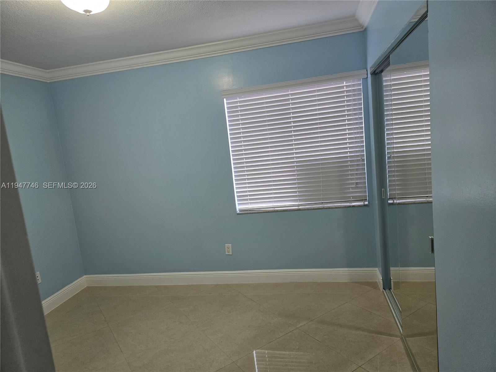 2749 West 73rd Place Hialeah, FL 33016 - Photo 8 of 15 a view of a room that has a window in it