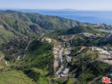 a view of a city with mountains in the background