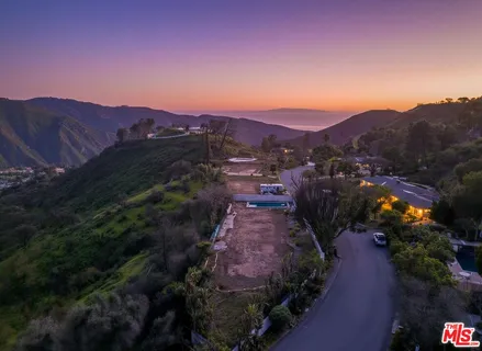 a view of a city with mountains in the background