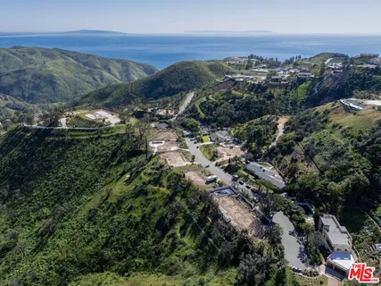 a view of a city with mountains in the background