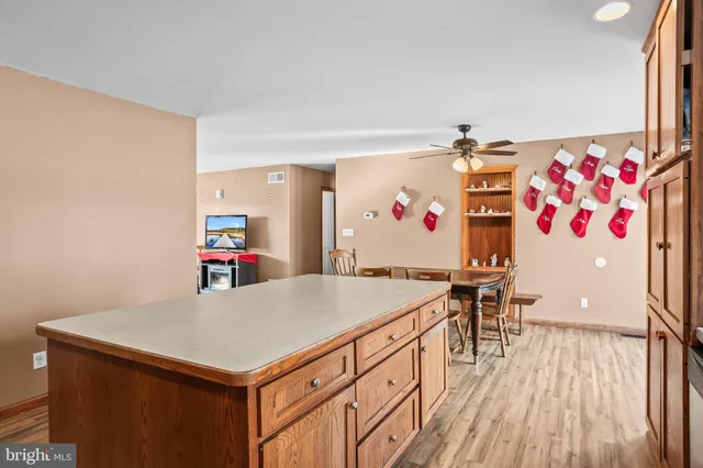a living room with a table and chairs