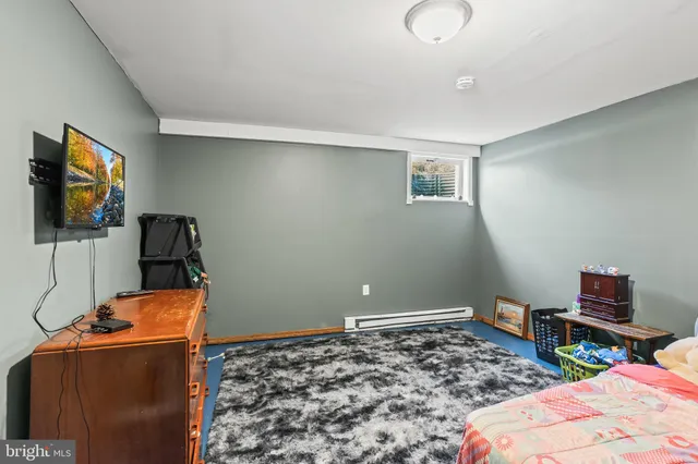 a bedroom with a bed and a mirror