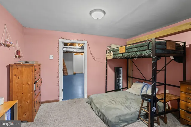 a view of a livingroom with furniture and a flat screen tv