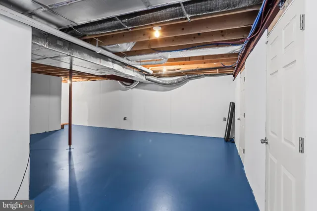 a view of room with wooden floor