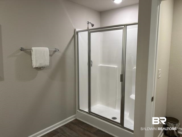 7409 Brompton Drive Foley, AL 36535 - Photo 10 of 18 Bathroom featuring hardwood / wood-style floors and an enclosed shower