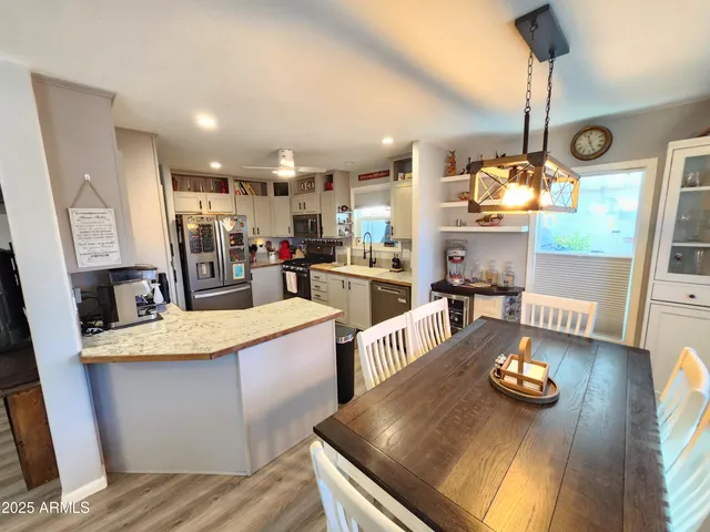 a kitchen with stainless steel appliances granite countertop a stove and a refrigerator