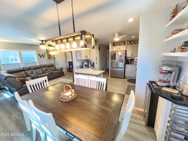 a kitchen with stainless steel appliances a stove a sink and white cabinets
