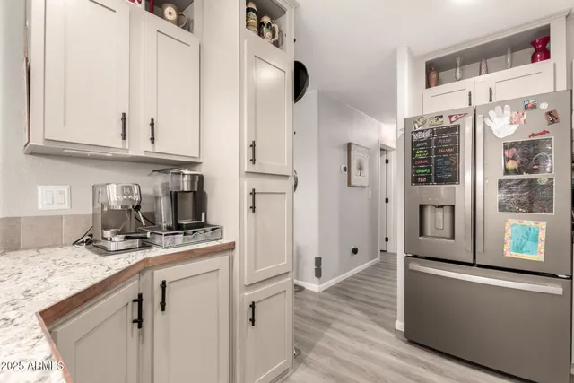 a bedroom with bed and wooden floor