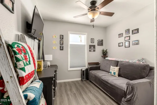 a work room with furniture and a bookshelf