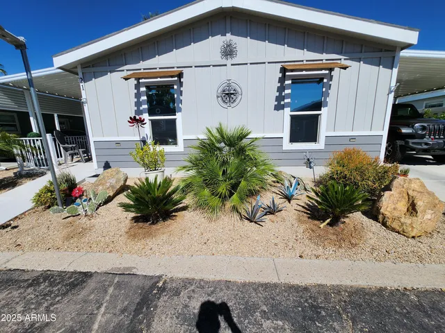 a view of front door and potted plants