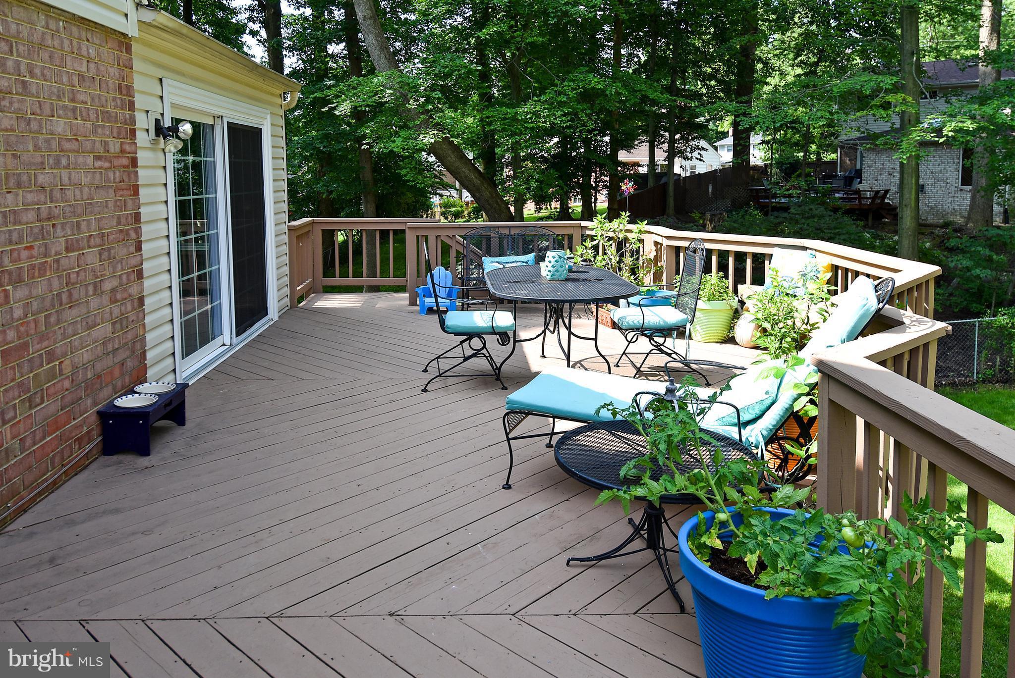 5506 Avon Court Springfield, VA 22151 - Photo 8 of 30 a view of deck with furniture and trees