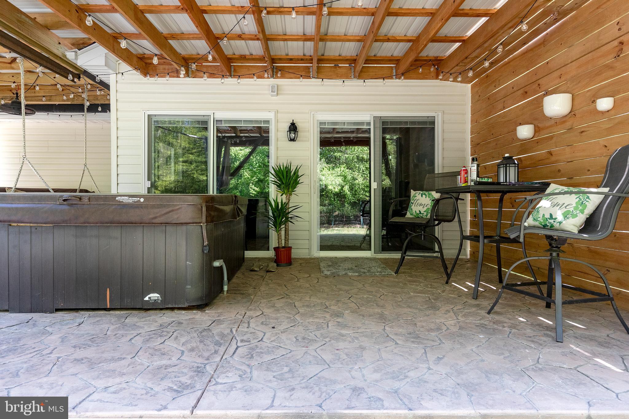 9308 Benson Road Lincoln, DE 19960 - Photo 12 of 59 Patio with Hot Tub & Pergola Shade