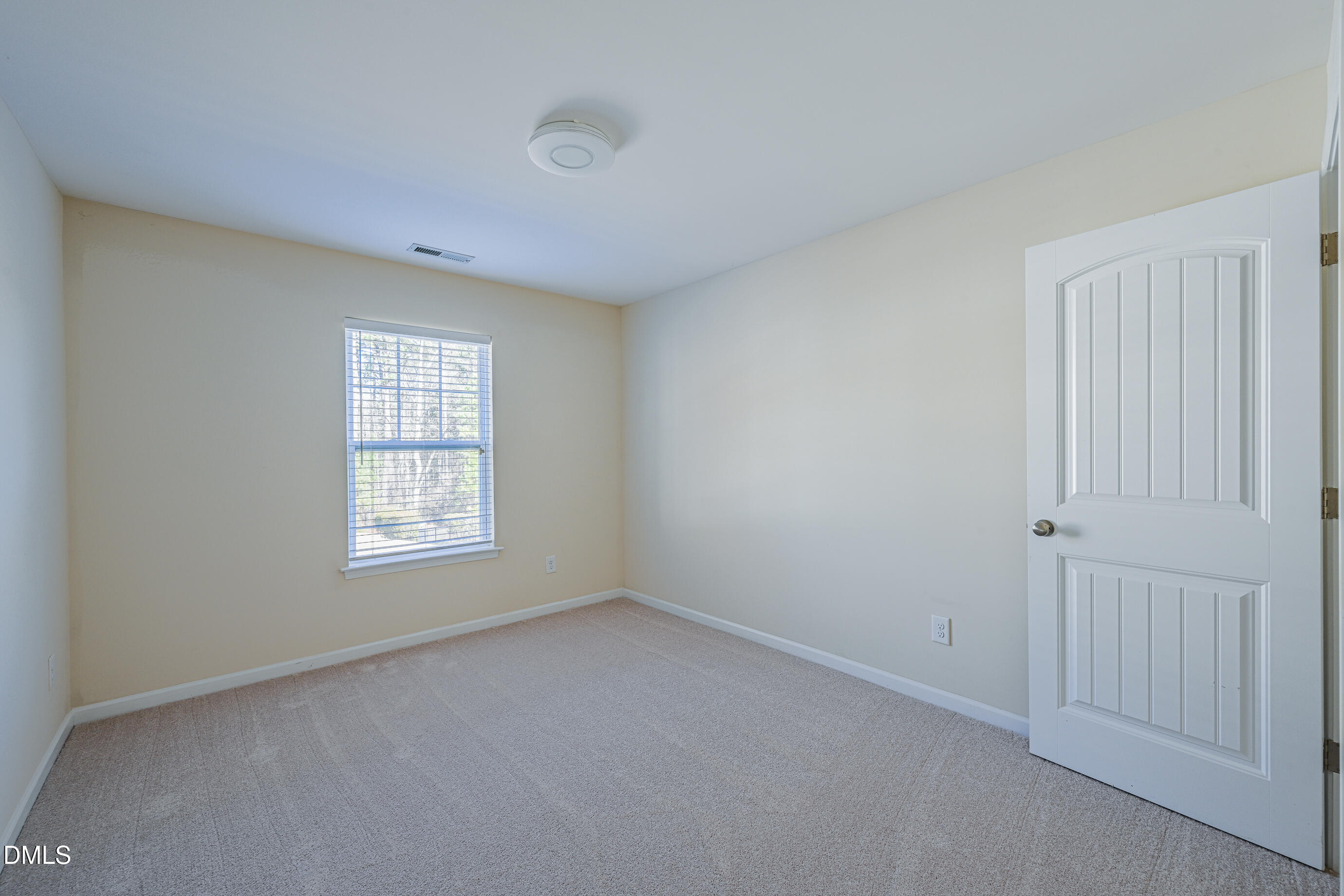 1260 Silver Beach Way Raleigh, NC 27606 - Photo 20 of 24 a view of an empty room with a window