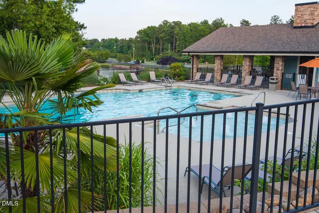 a view of a house with backyard and porch