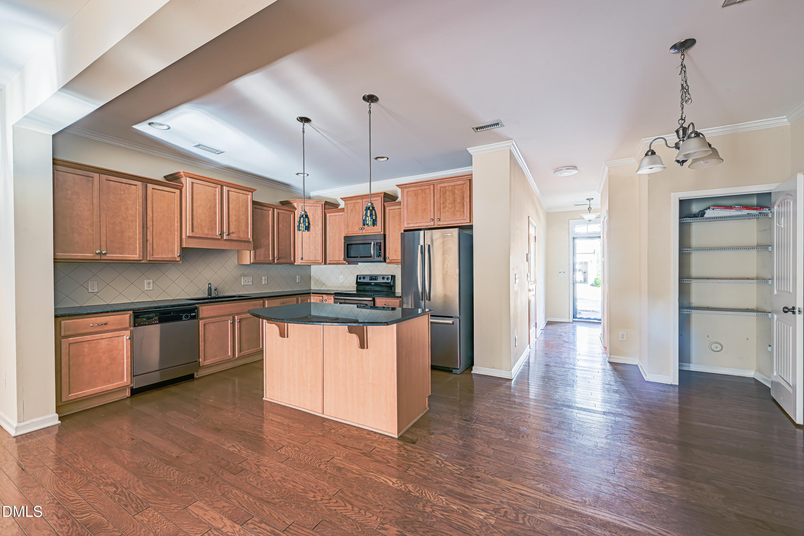 1260 Silver Beach Way Raleigh, NC 27606 - Photo 7 of 24 a kitchen with stainless steel appliances granite countertop a refrigerator a sink dishwasher a stove and white cabinets with wooden floor