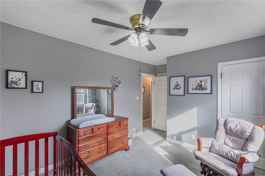 436 Marjorie Avenue Riverside, OH 45404 - Photo 16 of 34 This cozy bedroom features plush carpeting and a functional ceiling fan for comfort.