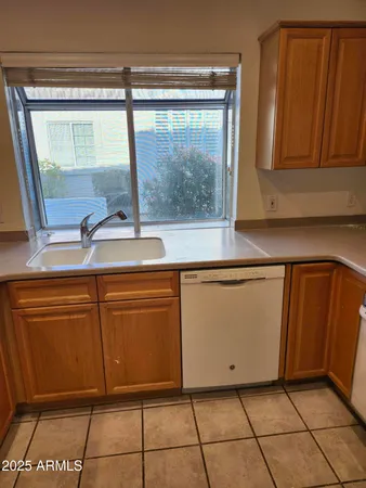 a view of a sink and a dishwasher