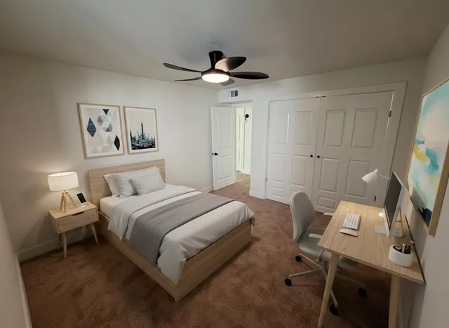 a bedroom with a bed and a flat screen tv