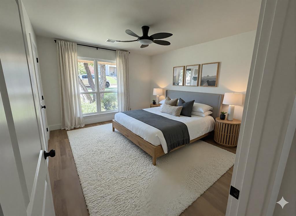 424 Valley Park Drive Garland, TX 75043 - Photo 7 of 18 a bedroom with a bed and a large mirror