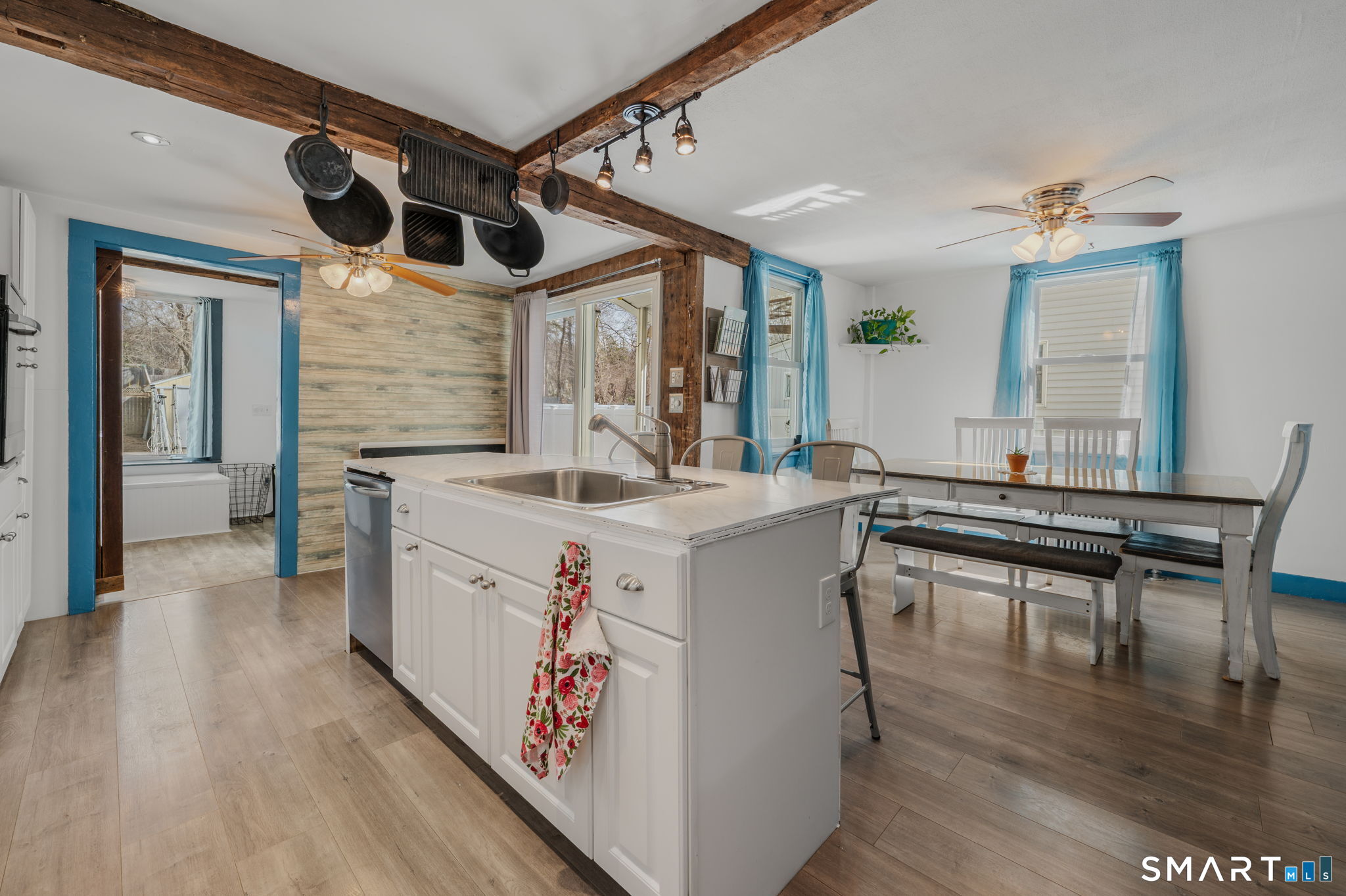 118 Highway 2A Preston, CT 06365 - Photo 12 of 31 a kitchen with a stove a sink and a wooden floor