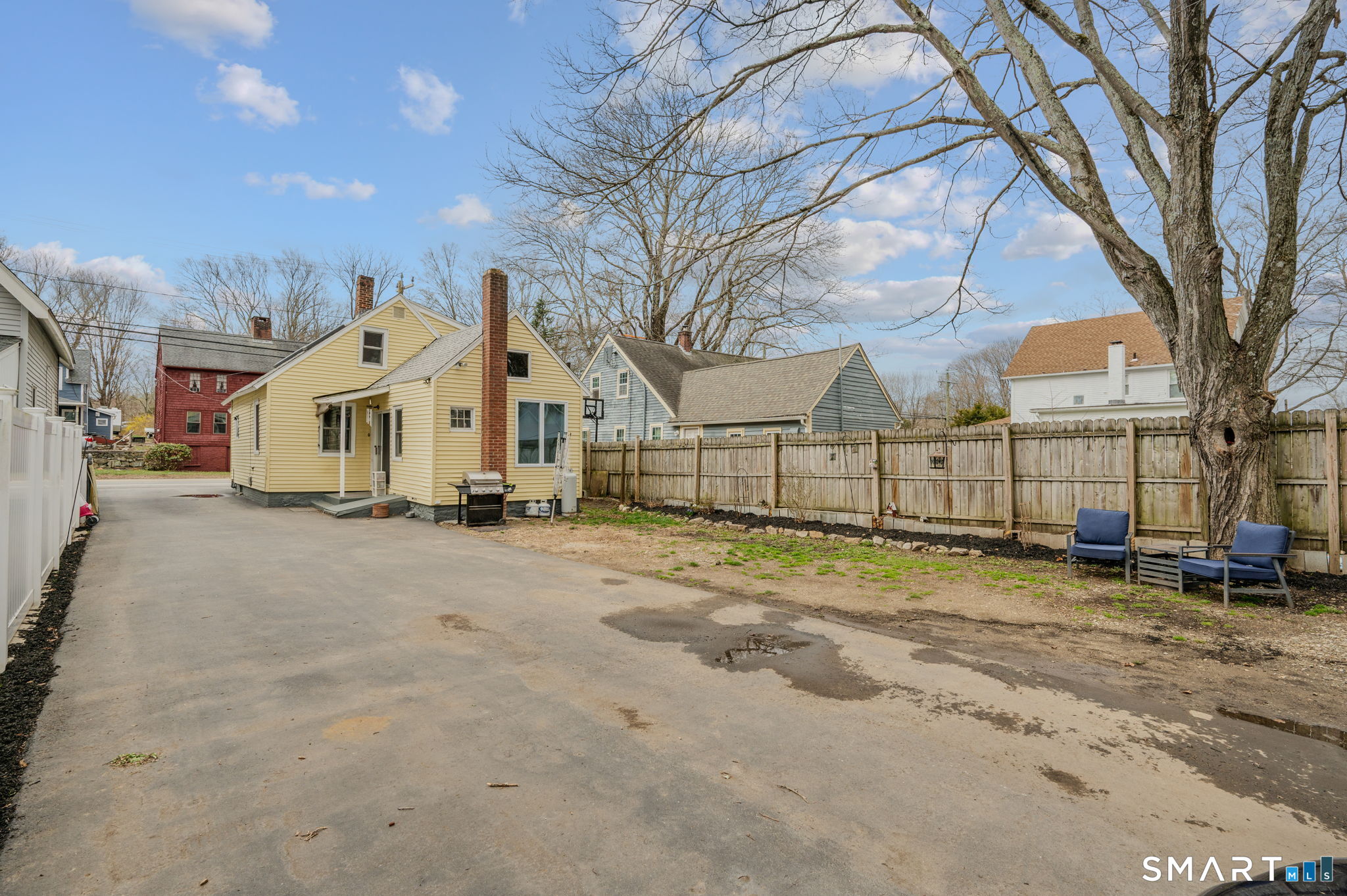 118 Highway 2A Preston, CT 06365 - Photo 24 of 31 a view of a white house with a large trees and yard
