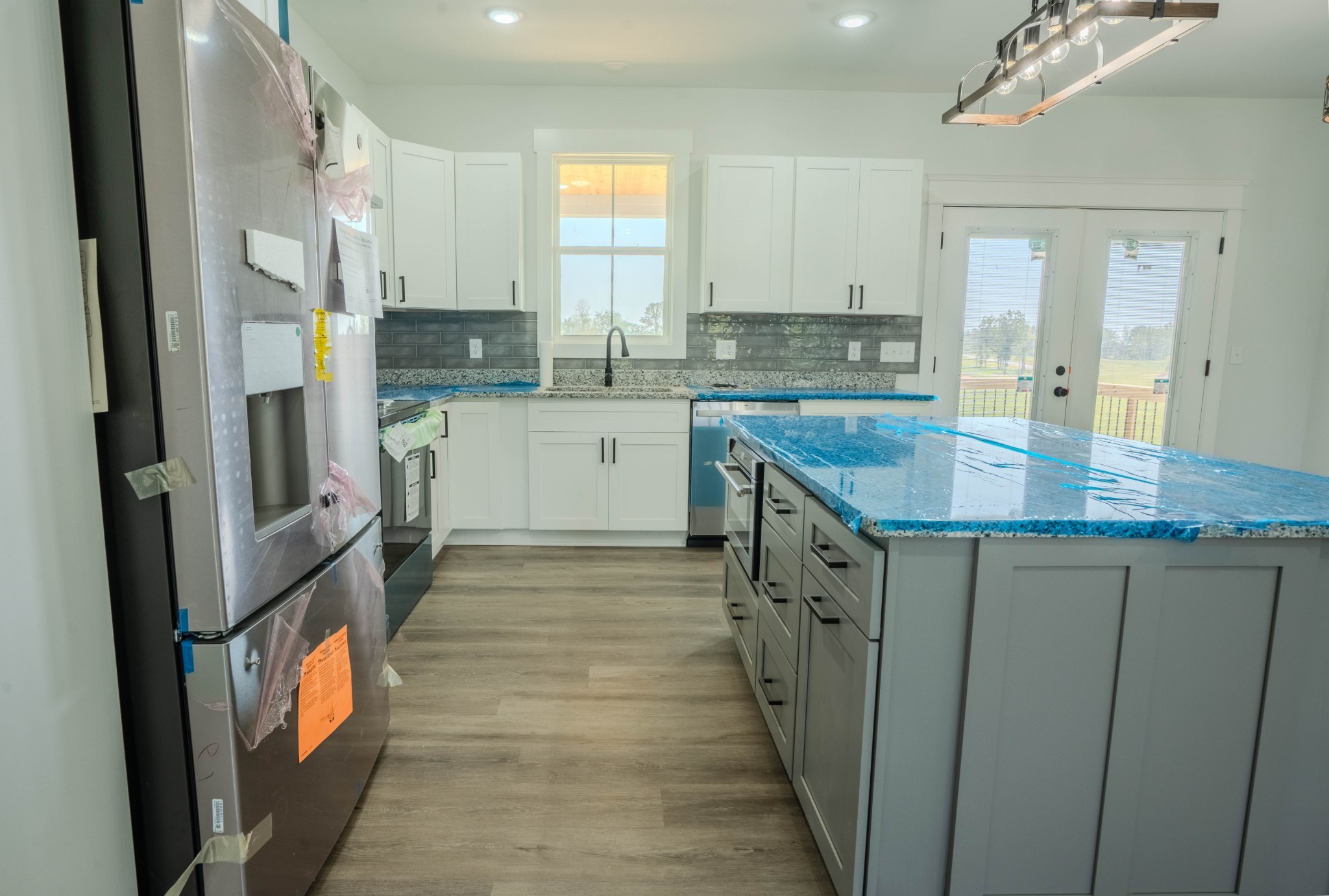 176 Beartown Road Loretto, TN 38469 - Photo 16 of 46 a kitchen with a sink stove and cabinets