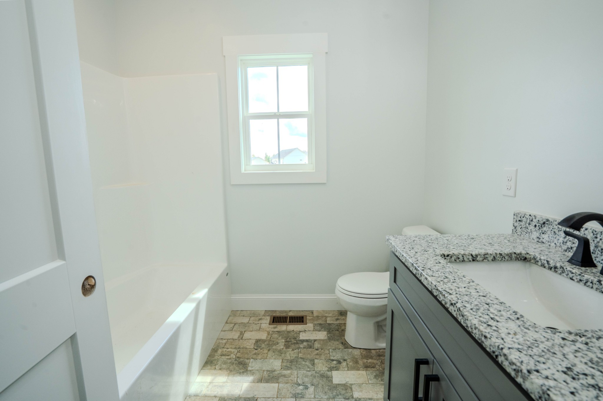 176 Beartown Road Loretto, TN 38469 - Photo 22 of 46 a bathroom with a granite countertop sink a toilet and a mirror