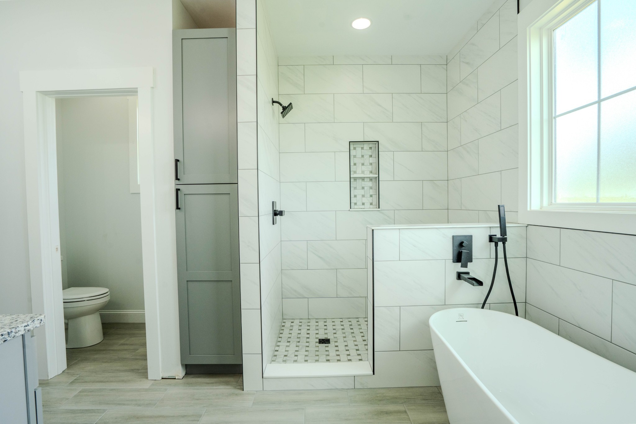 176 Beartown Road Loretto, TN 38469 - Photo 30 of 46 a bathroom with a tub and a toilet