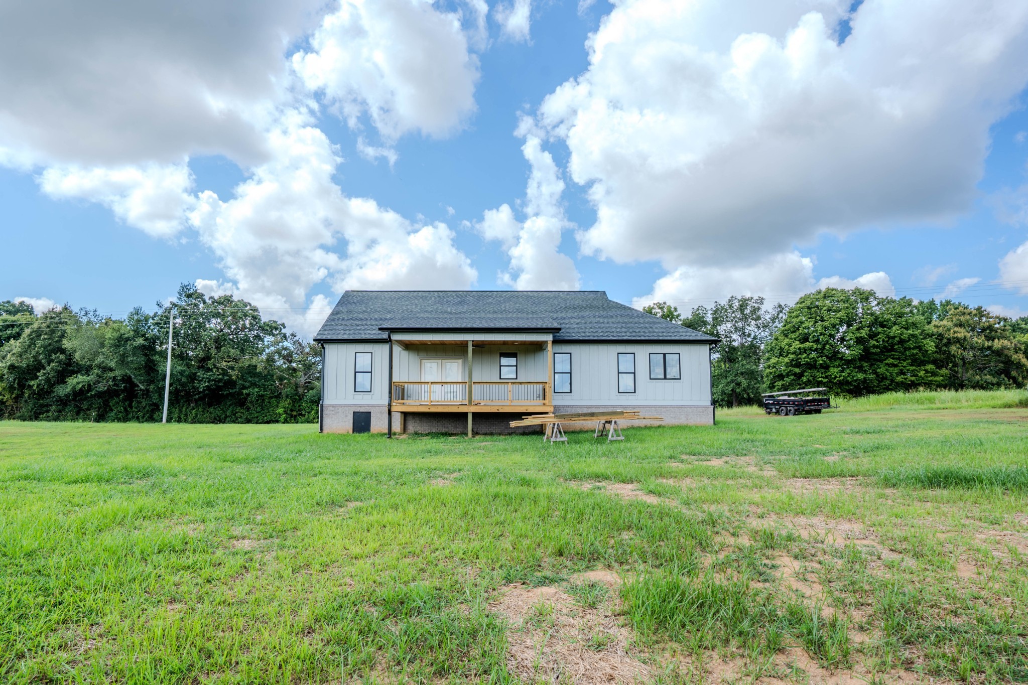 176 Beartown Road Loretto, TN 38469 - Photo 5 of 46 a view of a house with a big yard and a large tree