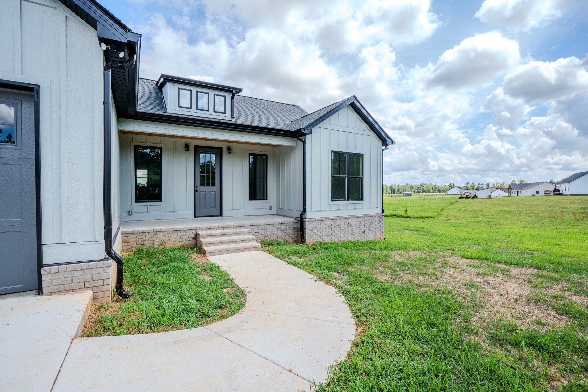 176 Beartown Road Loretto, TN 38469 - Photo 9 of 46 a front view of a house with garden