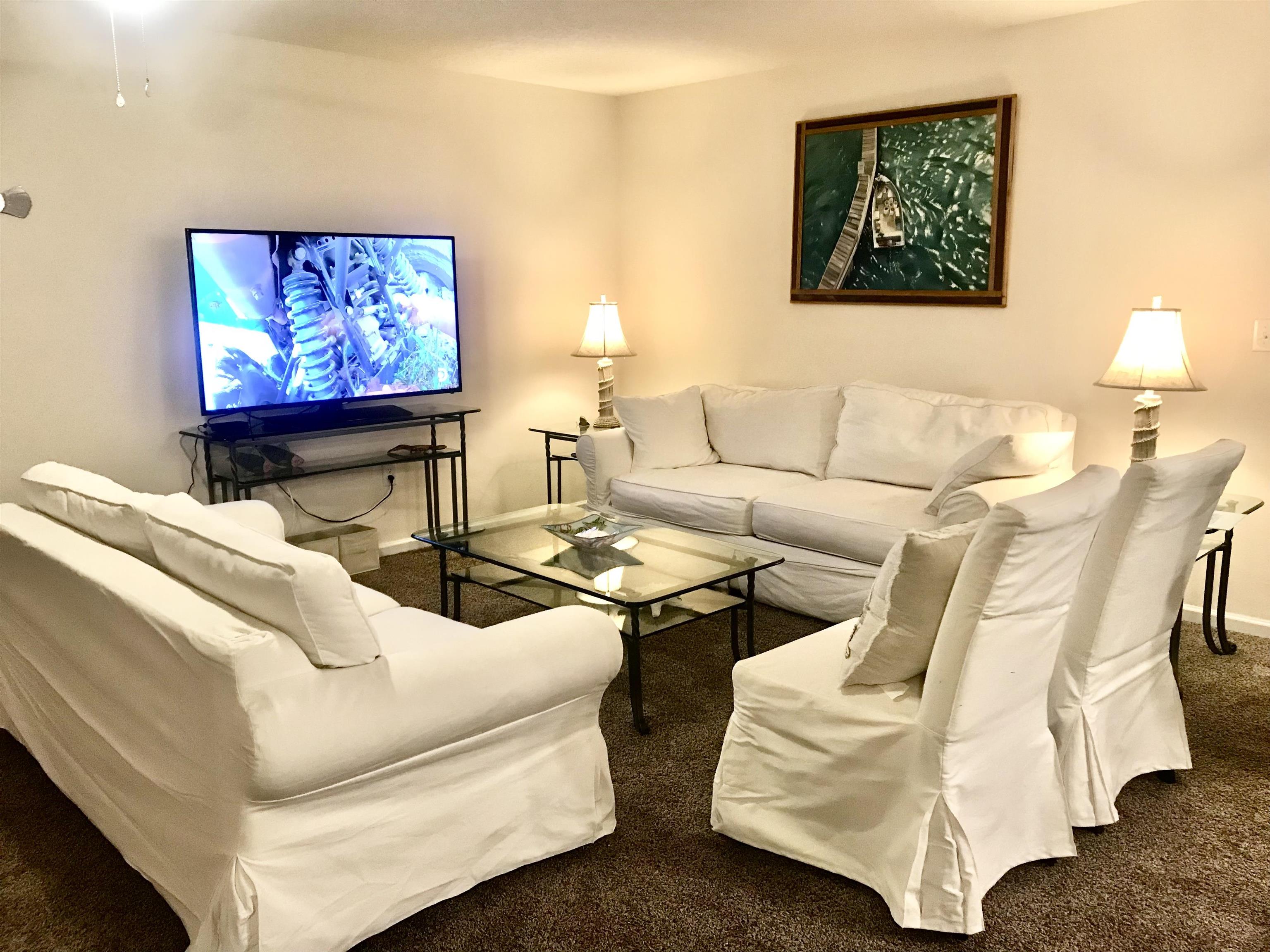 32 Del Mar Circle St. Augustine, FL 32086 - Photo 6 of 21 a living room with furniture and a flat screen tv