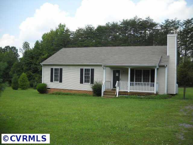 1960 Maidens Road Maidens, VA 23102 - Photo 1 of 5 a front view of a house with a yard and green space