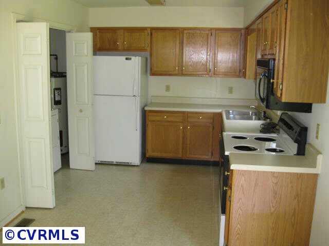 1960 Maidens Road Maidens, VA 23102 - Photo 4 of 5 a kitchen with a refrigerator a stove a sink and a stove
