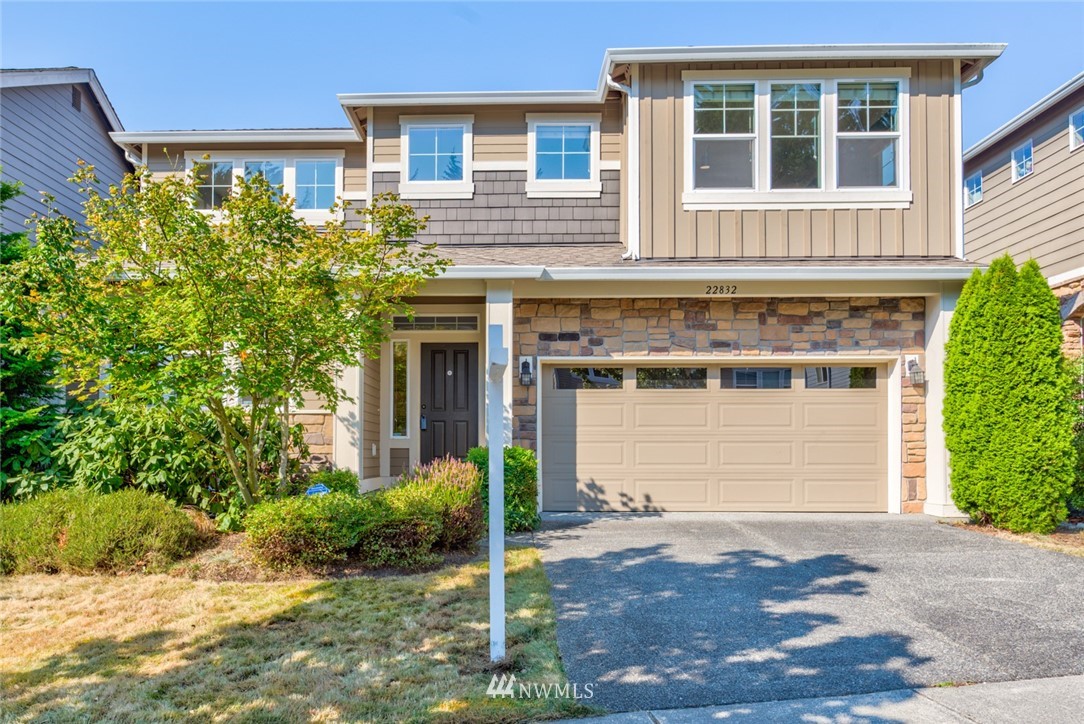 22832 36th Drive Southeast Bothell, WA 98021 - Photo 1 of 26 a front view of a house with a yard and garage