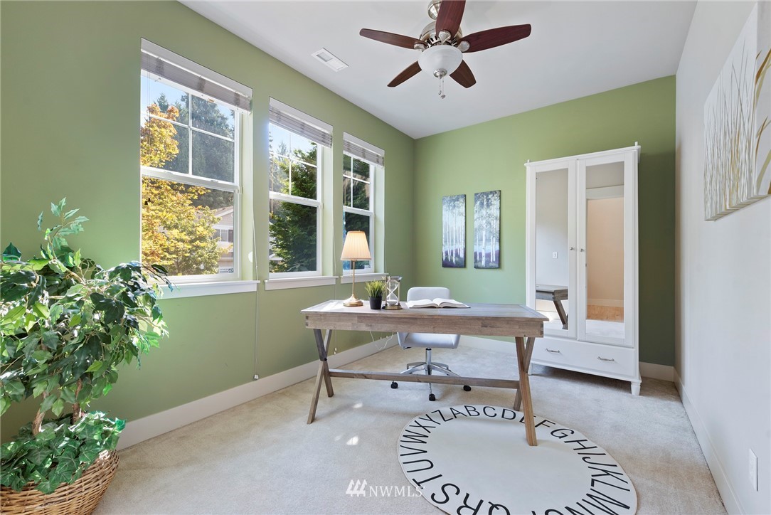 22832 36th Drive Southeast Bothell, WA 98021 - Photo 7 of 26 a living room with furniture and a window
