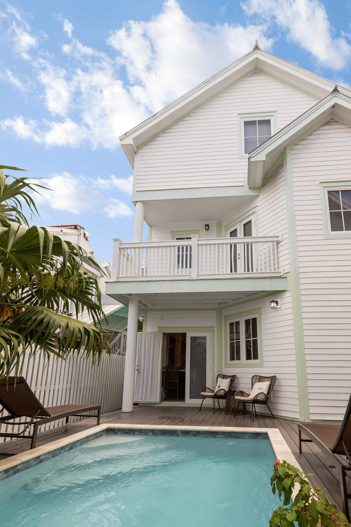 1011 Simonton Street, Unit R1 Key West, FL 33040 - Photo 33 of 35 a front view of a house with a yard