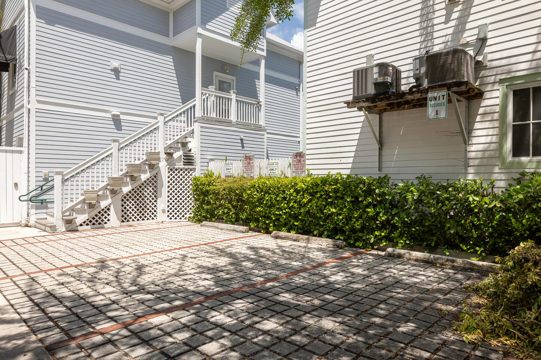 1011 Simonton Street, Unit R1 Key West, FL 33040 - Photo 35 of 35 a view of a backyard with plants and wooden fence