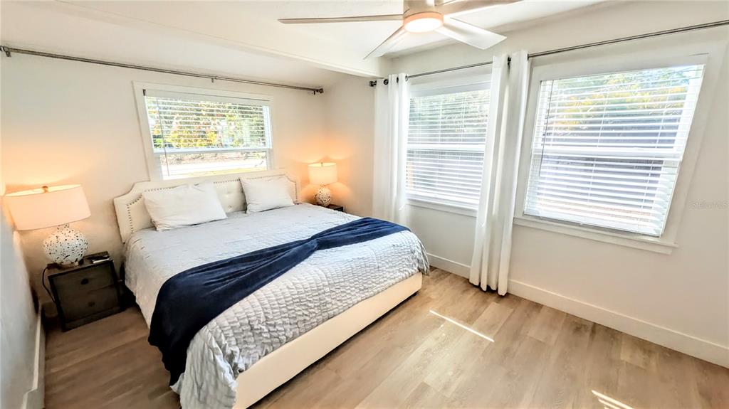 4515 Spahn Street Sarasota, FL 34232 - Photo 15 of 37 a bedroom with a large bed and a window