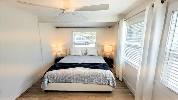 a bedroom with a bed and a view of bathroom
