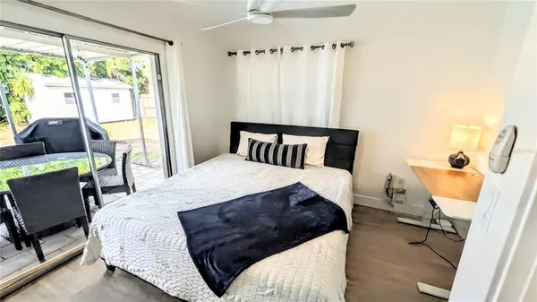 a bedroom with a bed and a mirror