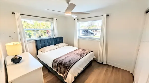 a bedroom with a bunk bed and a table