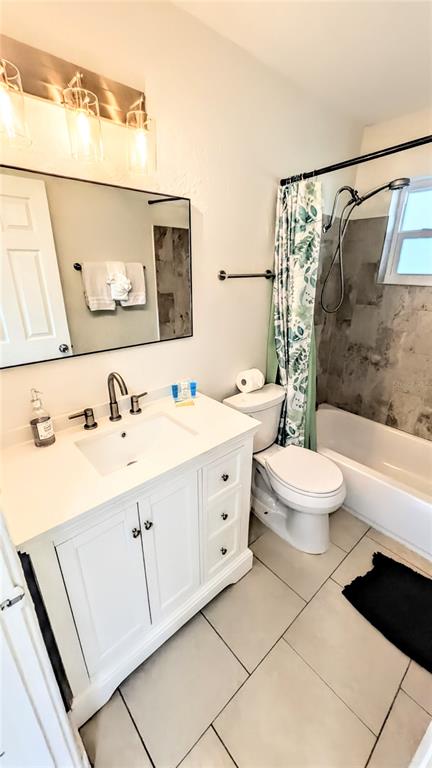 4515 Spahn Street Sarasota, FL 34232 - Photo 28 of 37 a bathroom with a double vanity sink mirror and toilet