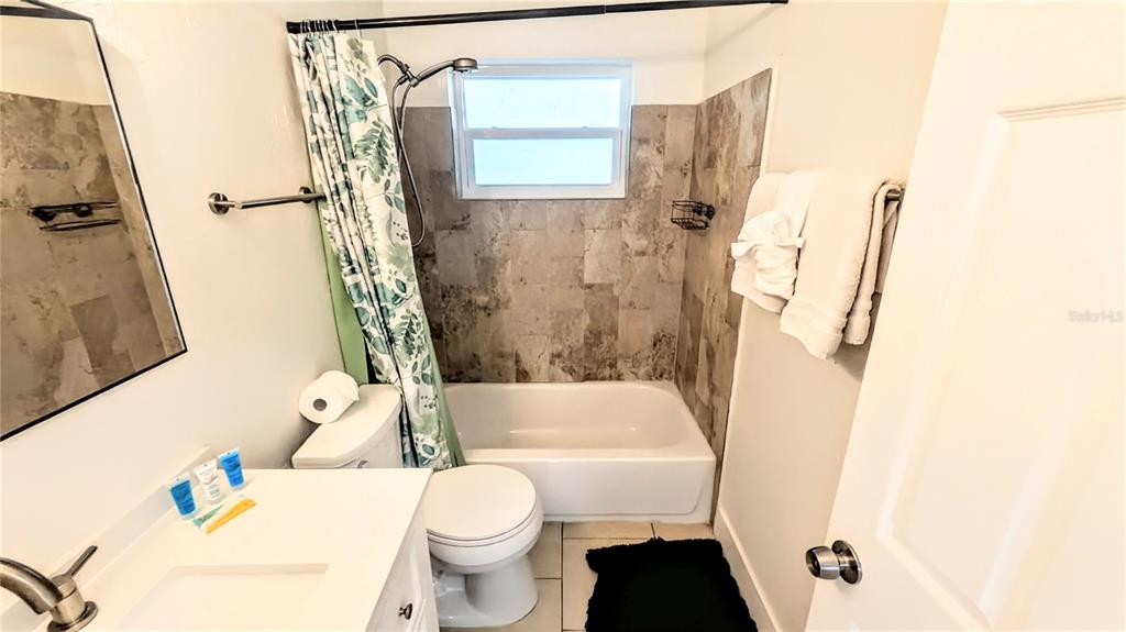 4515 Spahn Street Sarasota, FL 34232 - Photo 29 of 37 a bathroom with a sink toilet and shower