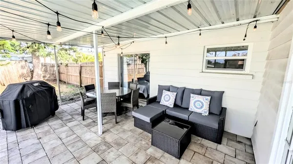 a view of a swimming pool with a patio