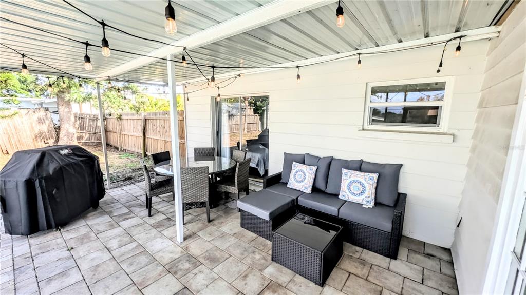 4515 Spahn Street Sarasota, FL 34232 - Photo 30 of 37 a living room with furniture and large windows