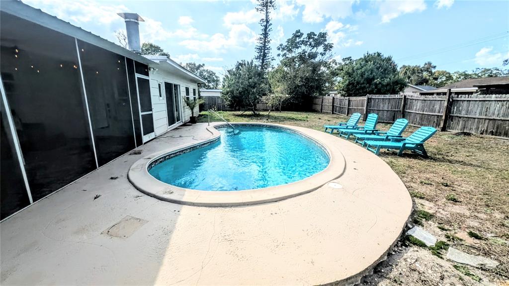 4515 Spahn Street Sarasota, FL 34232 - Photo 32 of 37 a view of a swimming pool with a patio