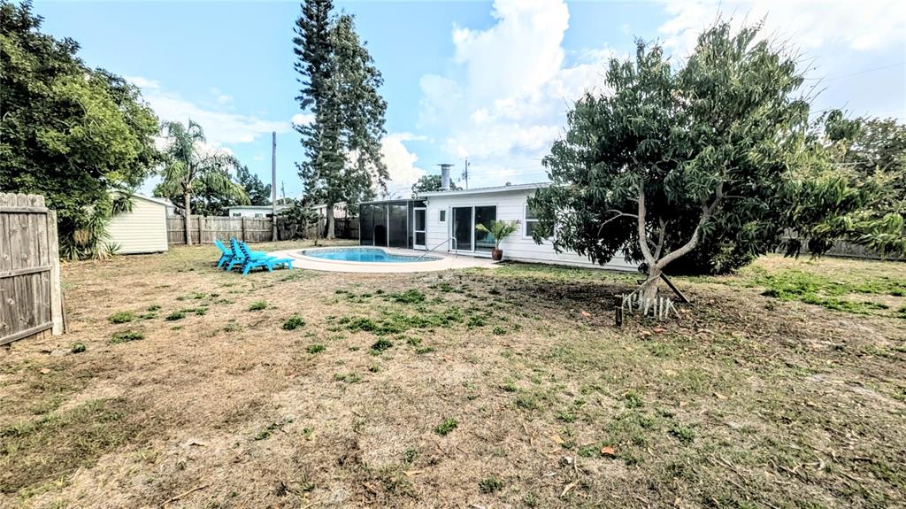 4515 Spahn Street Sarasota, FL 34232 - Photo 34 of 37 a view of a yard with plants and trees